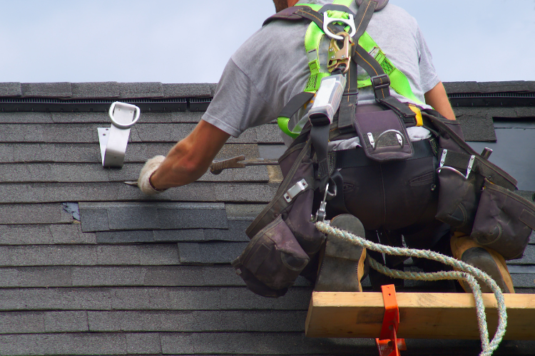 Strorm damaged shingles being replaced on a Bonney Lake roof