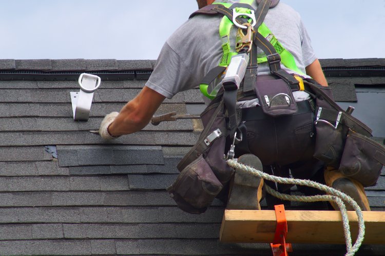 Strorm damaged shingles being replaced on a Bonney Lake roof