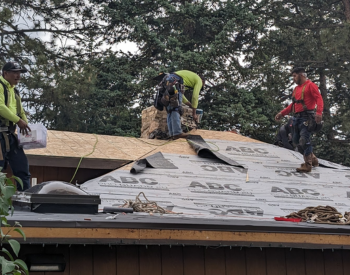 Experienced roofing contractors working on a roof in Auburn